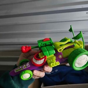 Fisher-Price DC Super Friends Hero World The Joker's Funny Car toy